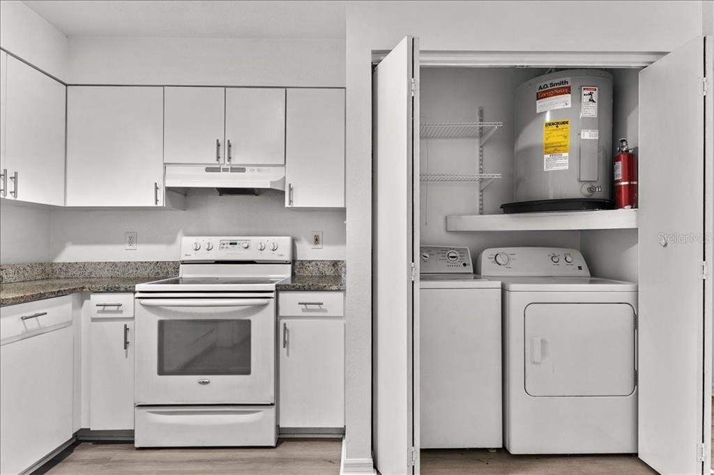 3417 Temple Street, Unit A Tampa, FL 33619 - Photo 10 of 30 a view of washer and dryer with kitchen appliances