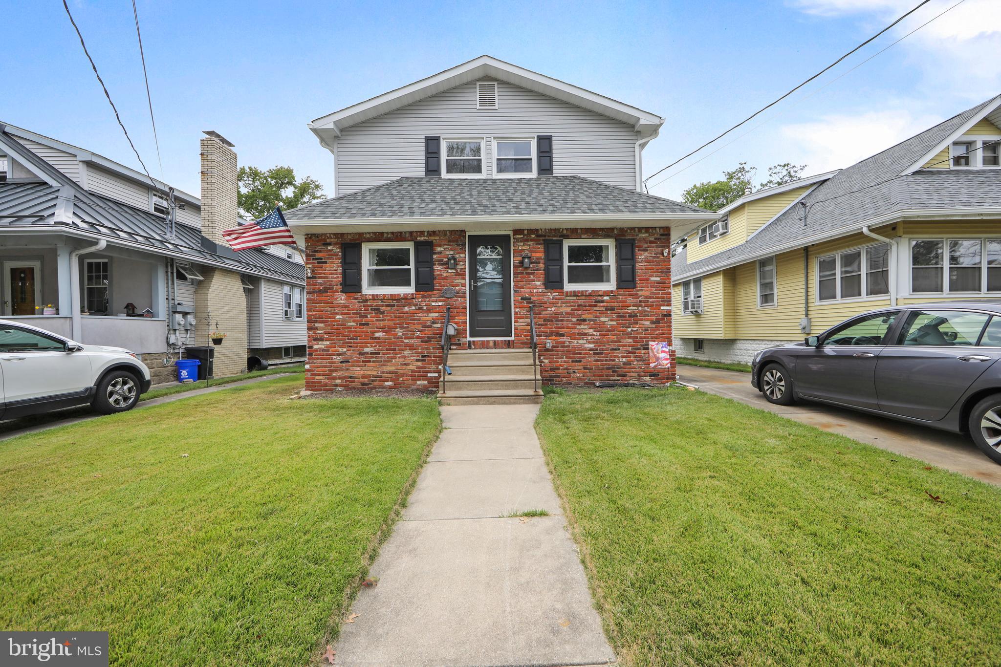 325 Landis Avenue Oaklyn, NJ 08107 - Photo 1 of 46 a front view of a house with garden