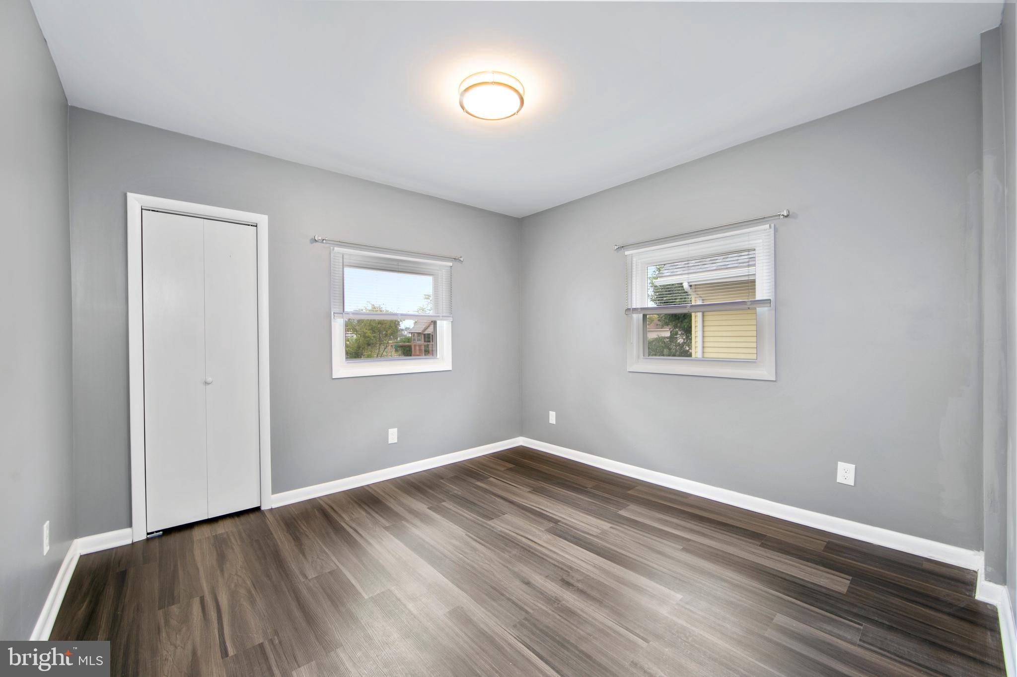 325 Landis Avenue Oaklyn, NJ 08107 - Photo 15 of 46 a view of room with window and wooden floor