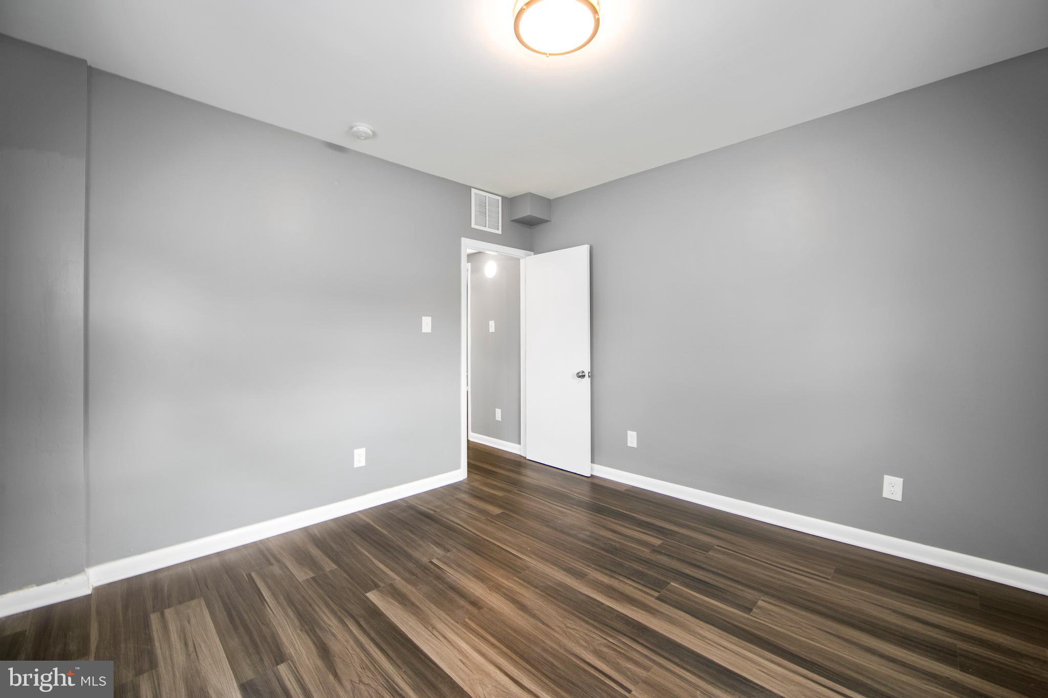 325 Landis Avenue Oaklyn, NJ 08107 - Photo 17 of 46 a view of an empty room with wooden floor