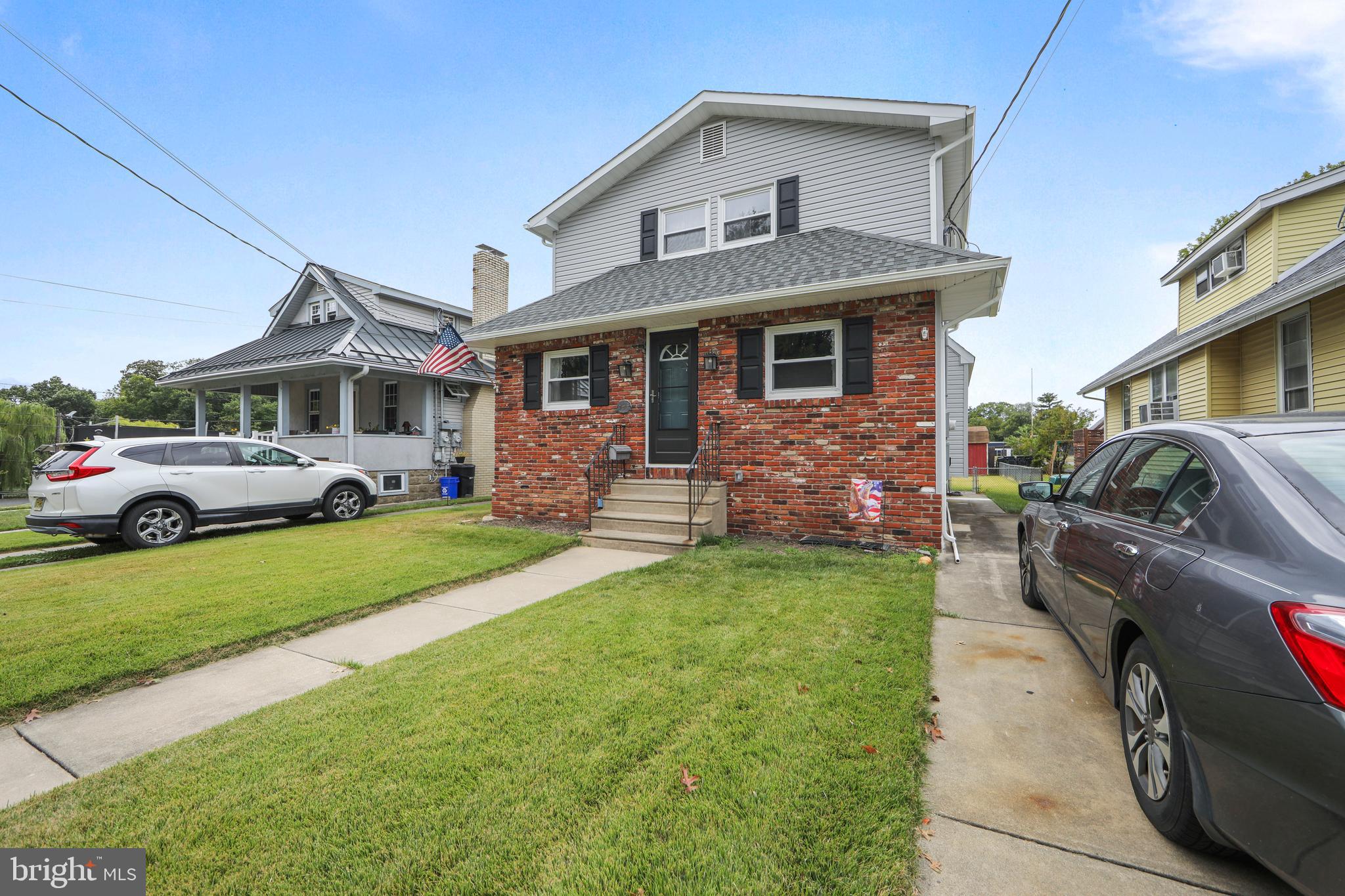 325 Landis Avenue Oaklyn, NJ 08107 - Photo 2 of 46 a front view of a house with garden