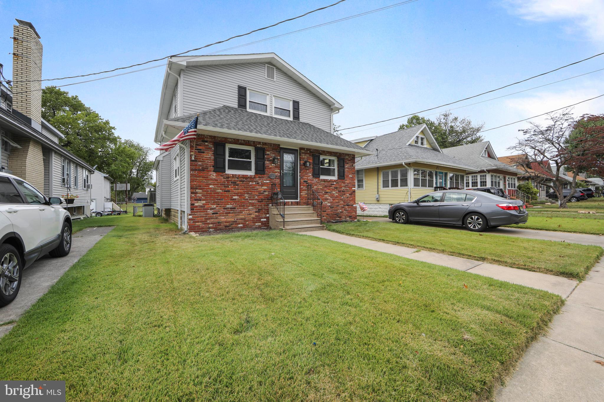 325 Landis Avenue Oaklyn, NJ 08107 - Photo 3 of 46 a front view of a house with garden