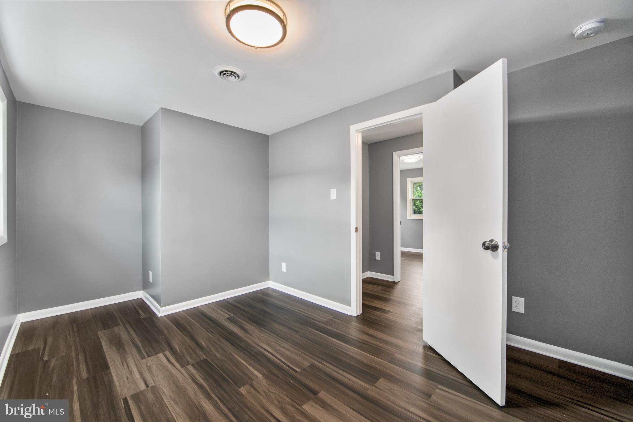 325 Landis Avenue Oaklyn, NJ 08107 - Photo 32 of 46 wooden floor in an empty room