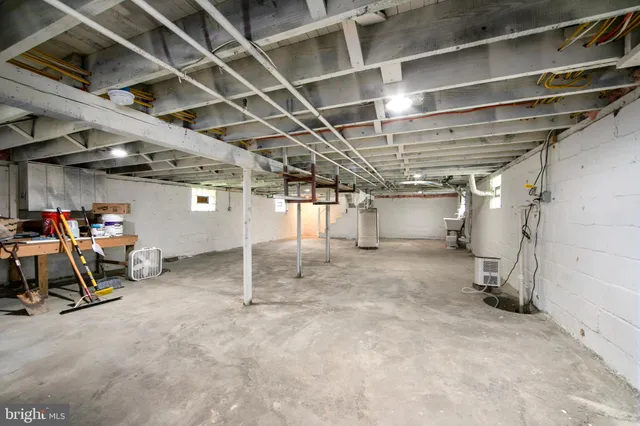 a view of empty room with wooden ceiling