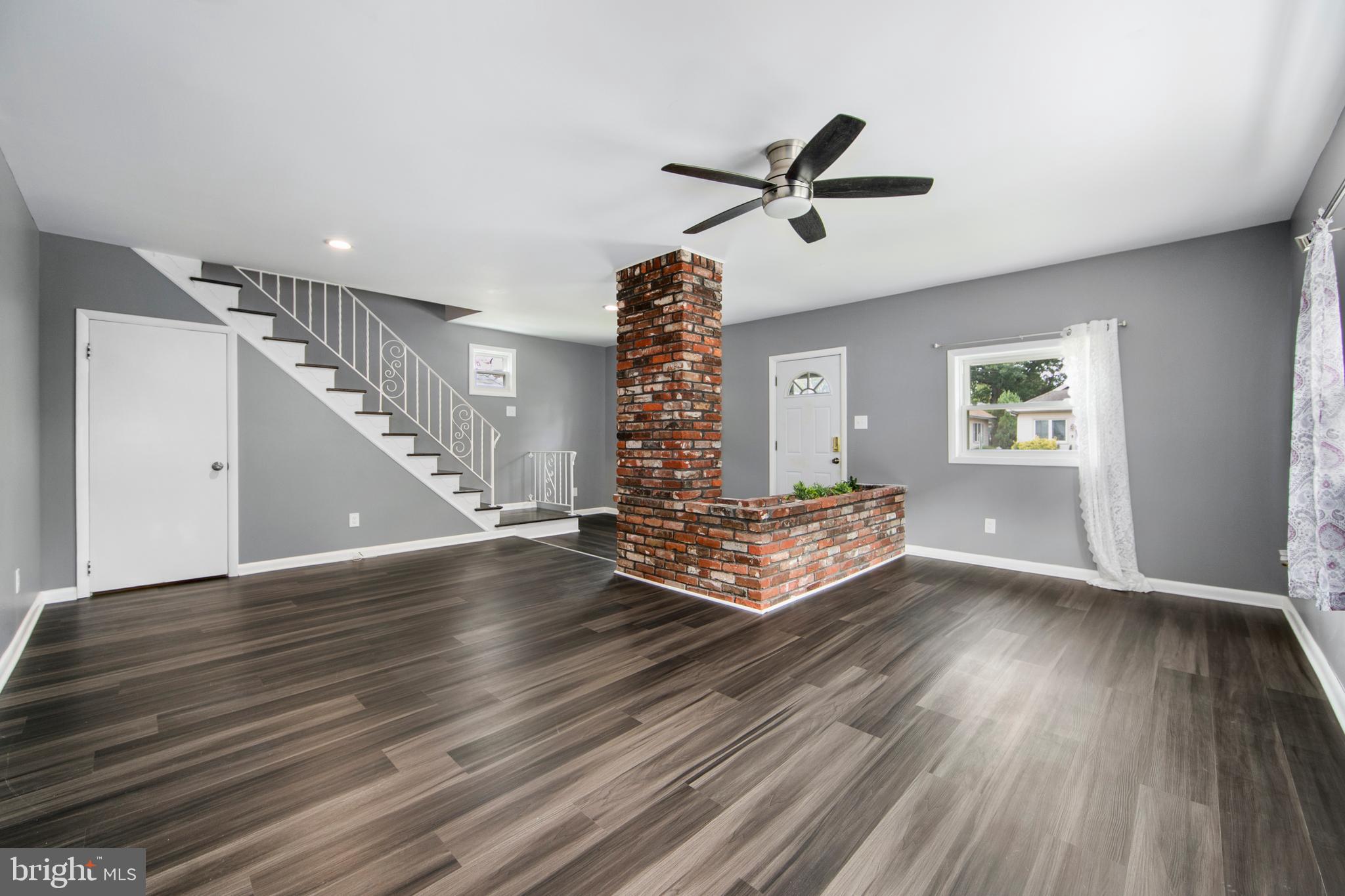 325 Landis Avenue Oaklyn, NJ 08107 - Photo 6 of 46 a view of empty room with wooden floor and window