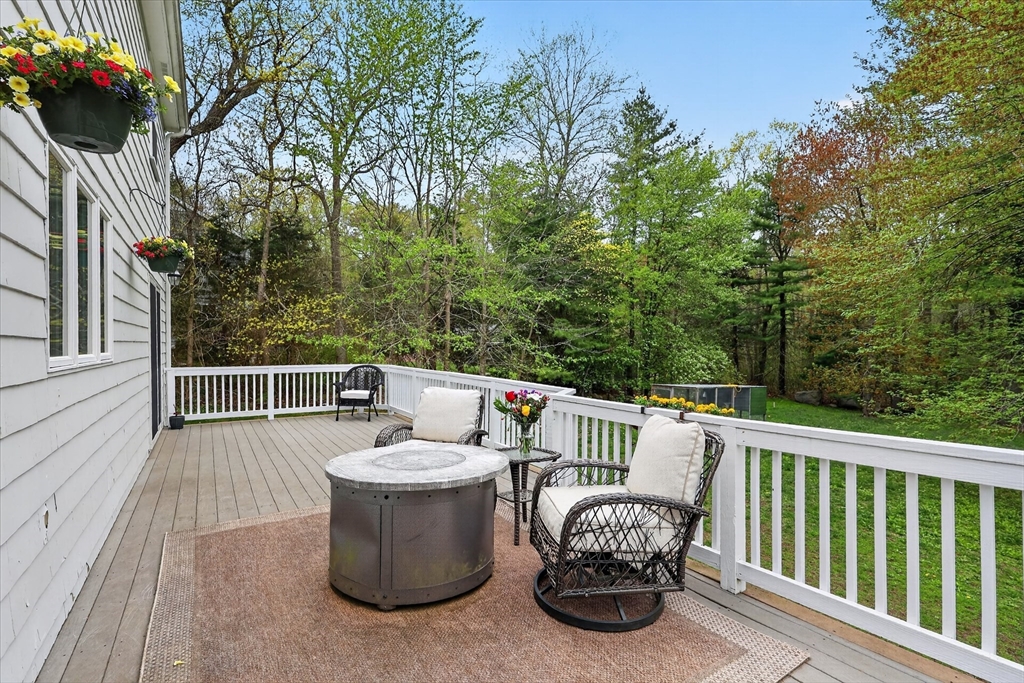 59 First Parish Road Norwell, MA 02061 - Photo 27 of 37 a view of roof deck with furniture and trees