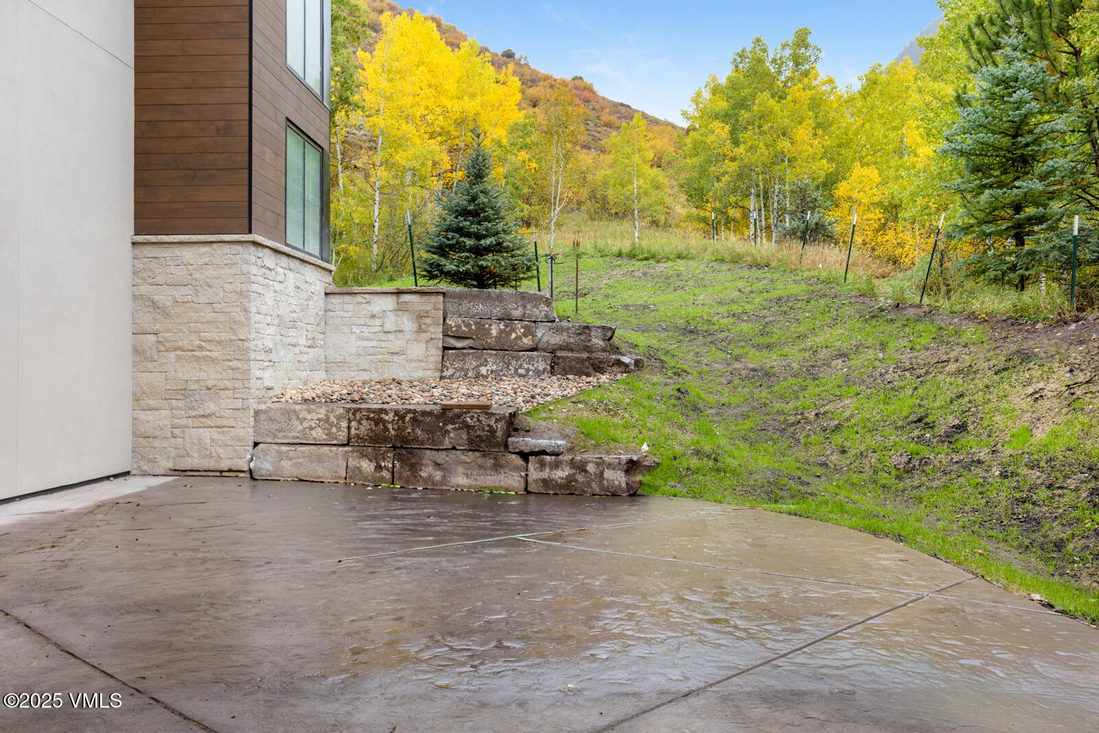 2811 Bald Mountain Road Vail, CO 81657 - Photo 58 of 59 a view of a patio with table and chairs and potted plants