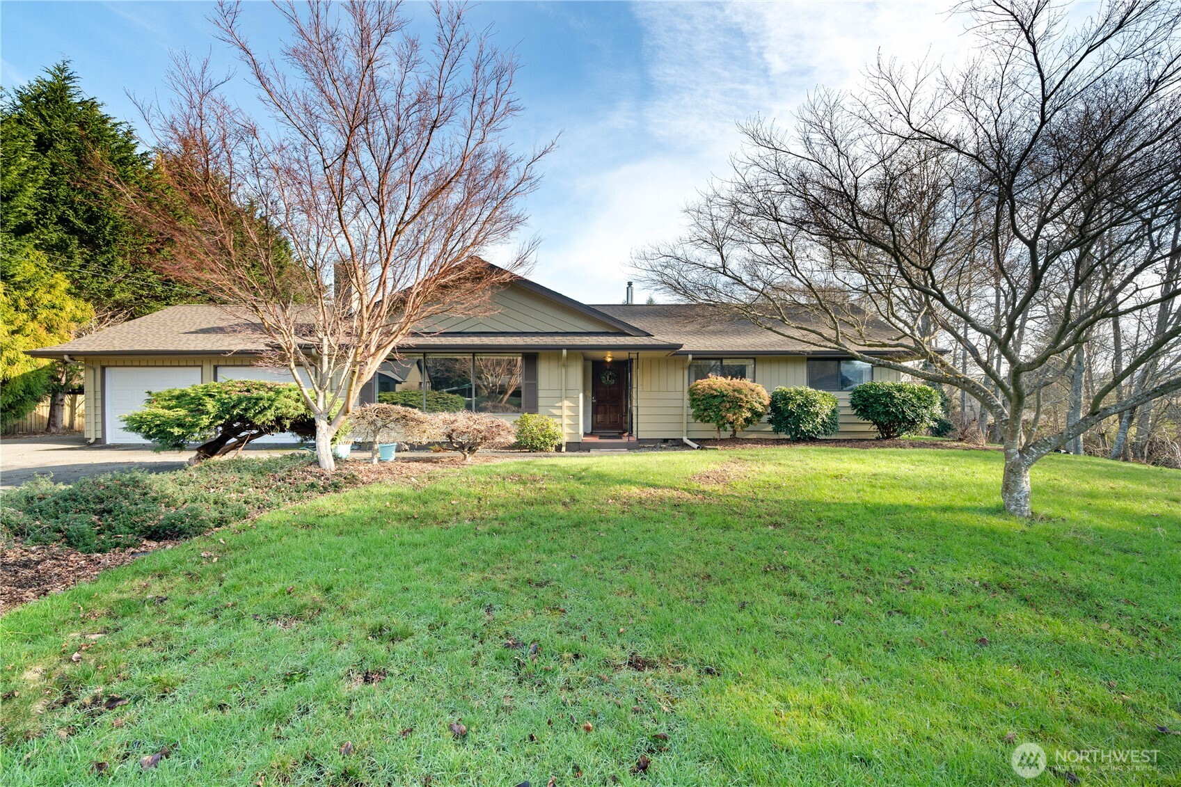 214 Talbot Street North Montesano, WA 98563 - Photo 1 of 40 a front view of a house with a garden