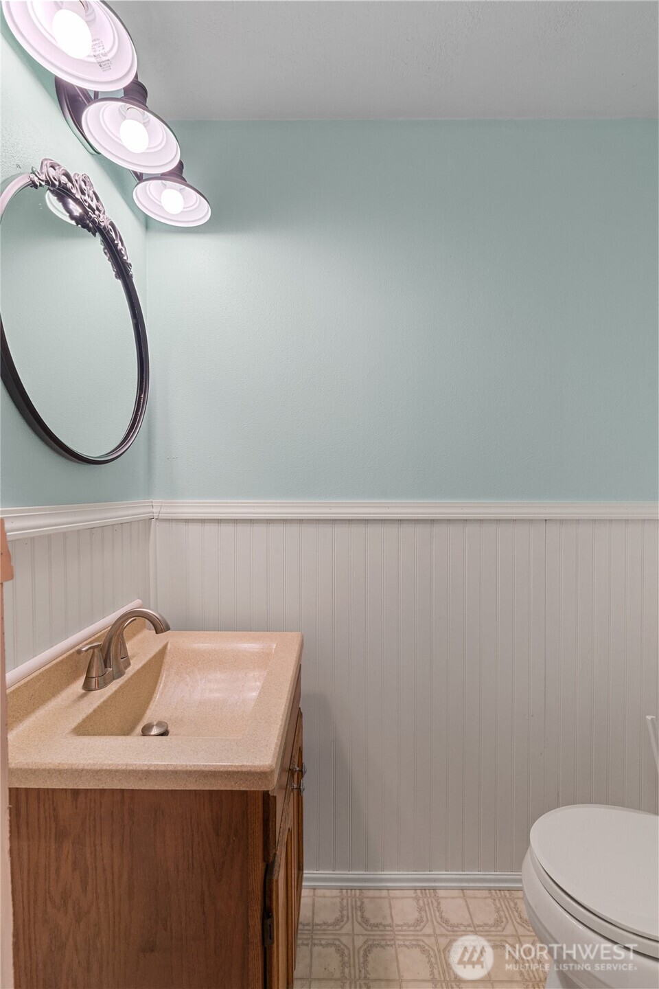 214 Talbot Street North Montesano, WA 98563 - Photo 11 of 40 a bathroom with a sink a toilet and a mirror