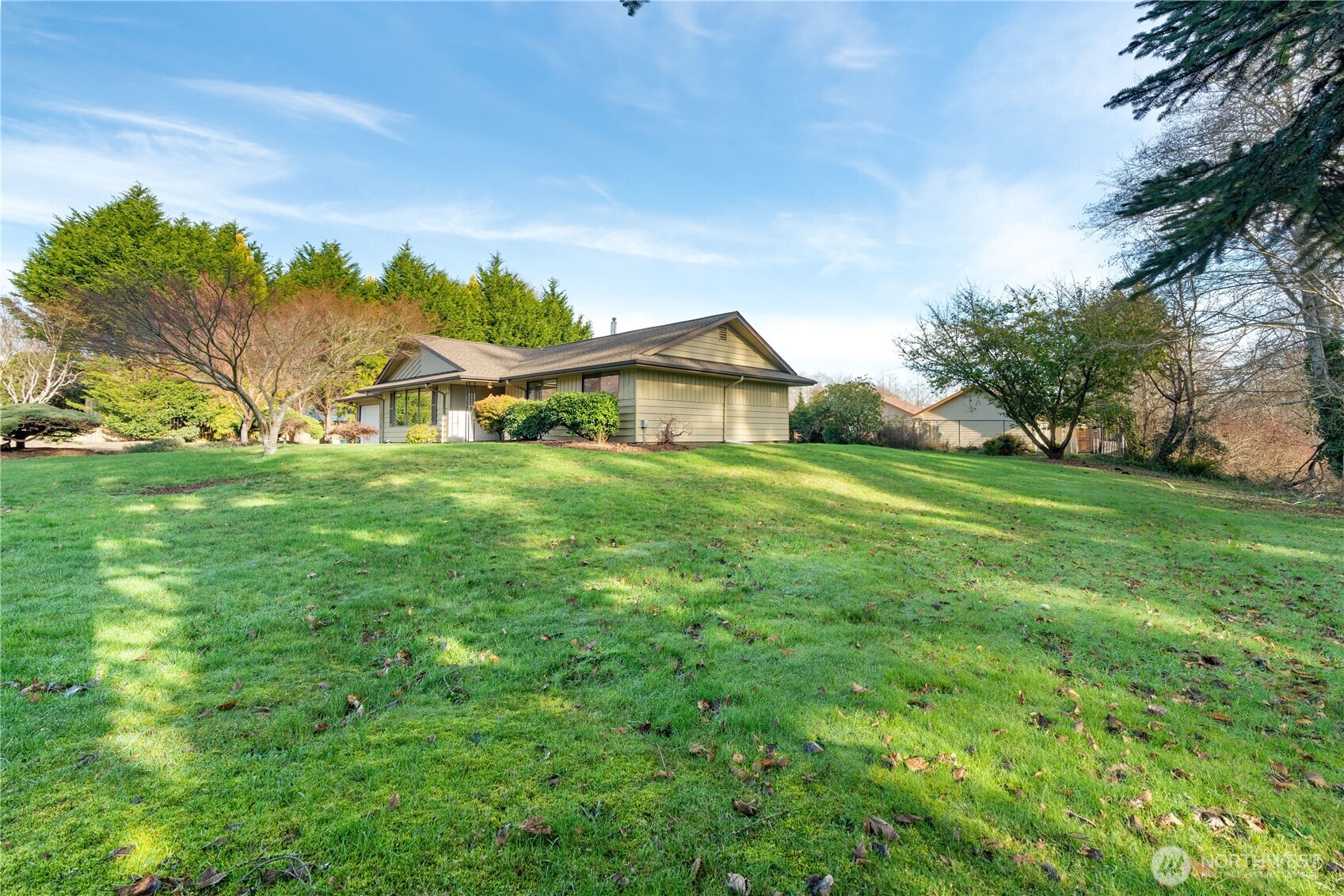 214 Talbot Street North Montesano, WA 98563 - Photo 27 of 40 a view of a house with a big yard and large trees