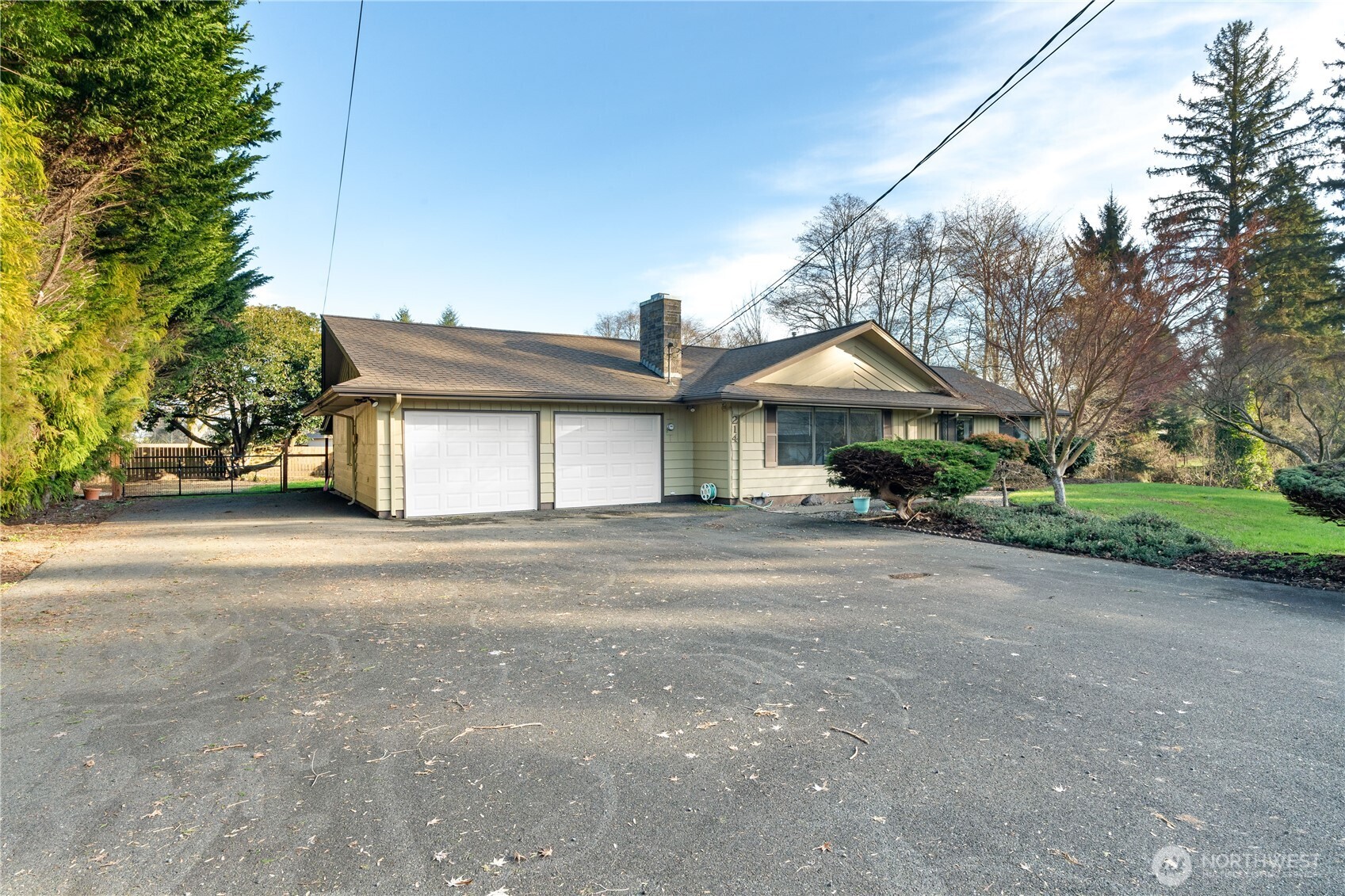 214 Talbot Street North Montesano, WA 98563 - Photo 32 of 40 a front view of a house with a yard and garage