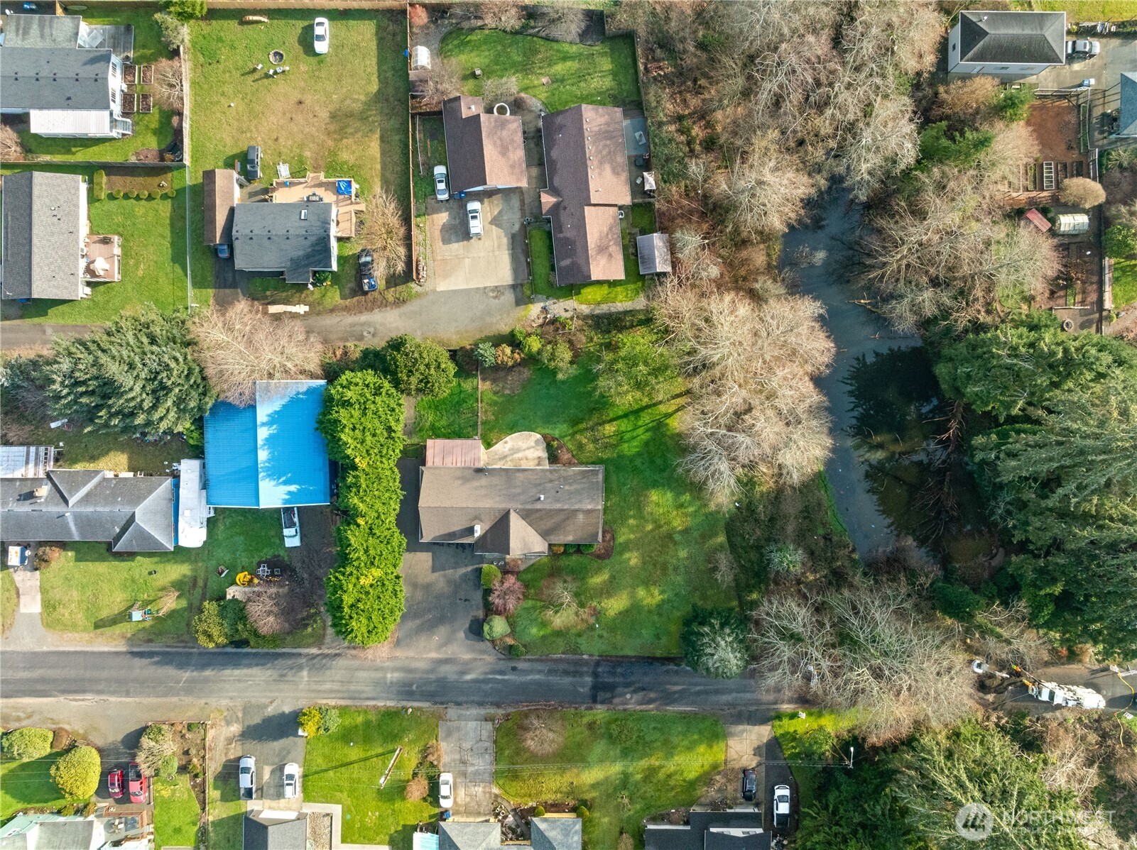 214 Talbot Street North Montesano, WA 98563 - Photo 33 of 40 an aerial view of a house with a yard and large trees