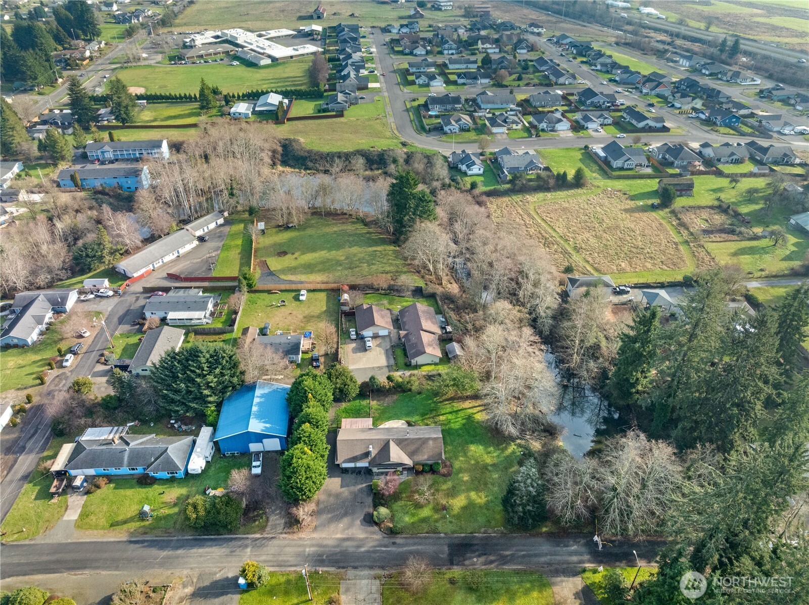 214 Talbot Street North Montesano, WA 98563 - Photo 34 of 40 an aerial view of residential houses with outdoor space and swimming pool