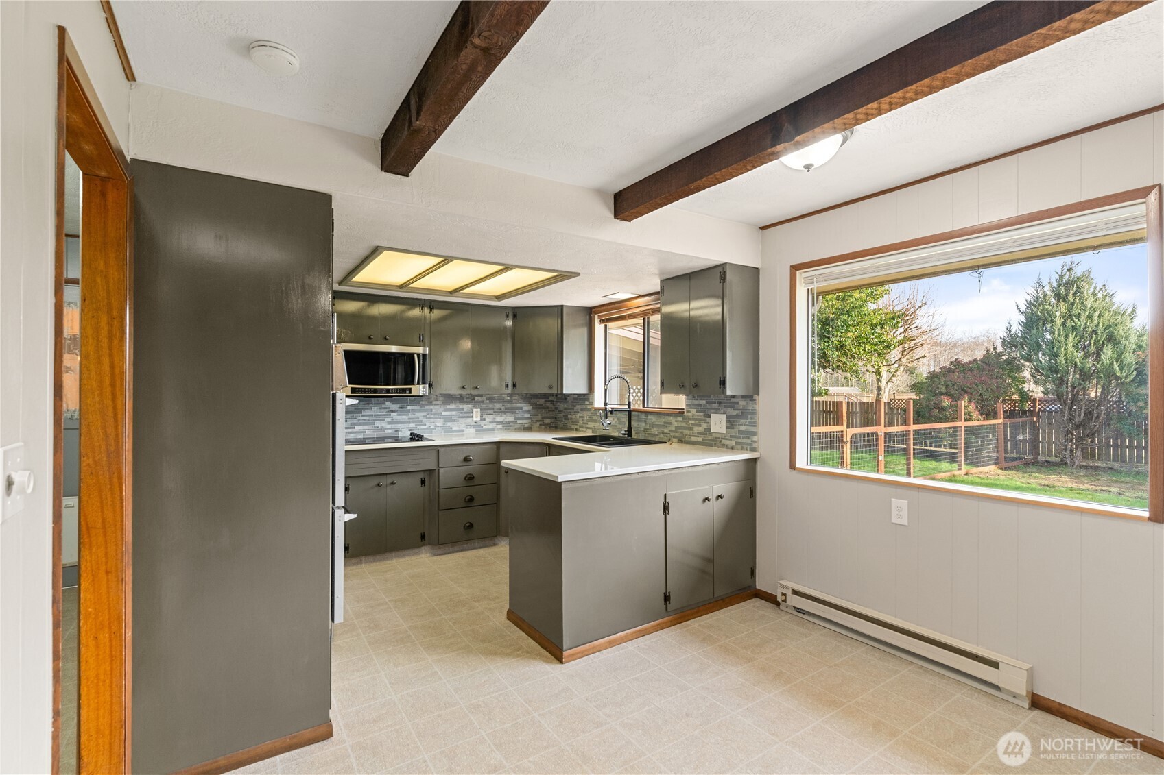 214 Talbot Street North Montesano, WA 98563 - Photo 9 of 40 a large white kitchen with a large window