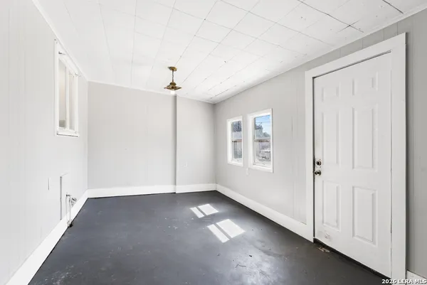 an empty room with windows