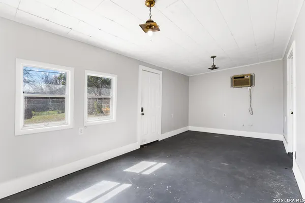 a view of a house with snow on the road