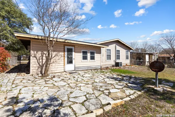 a view of a yard with a tree