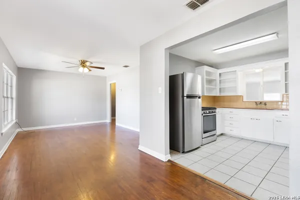 a room with a washing machine and sink