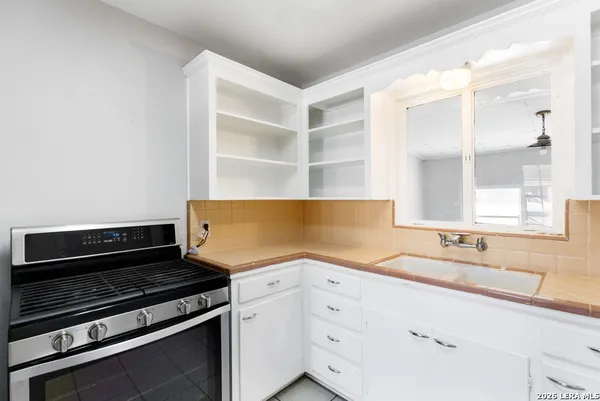 a kitchen with a sink and a refrigerator