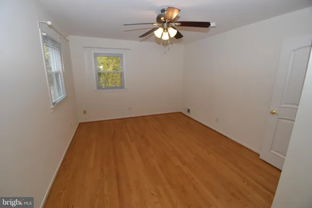 a view of empty room with windows