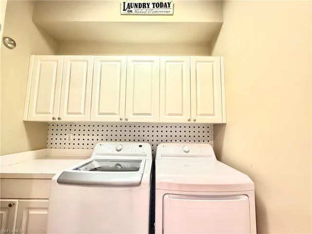 a bathroom with a sink a toilet and a shower curtain