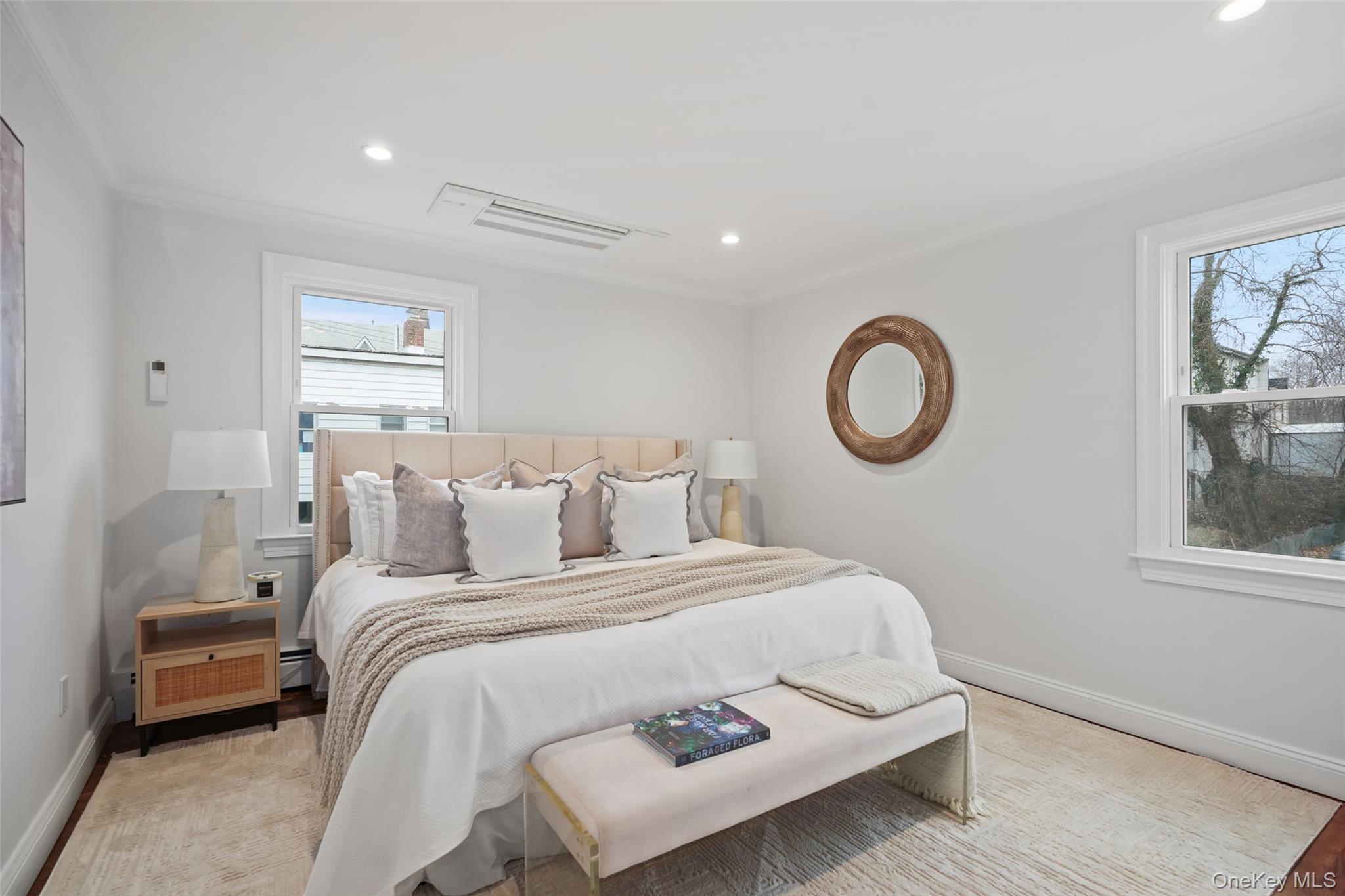 11 Orchard Avenue, Unit 3 Rye, NY 10580 - Photo 5 of 11 a bedroom with a bed and a window