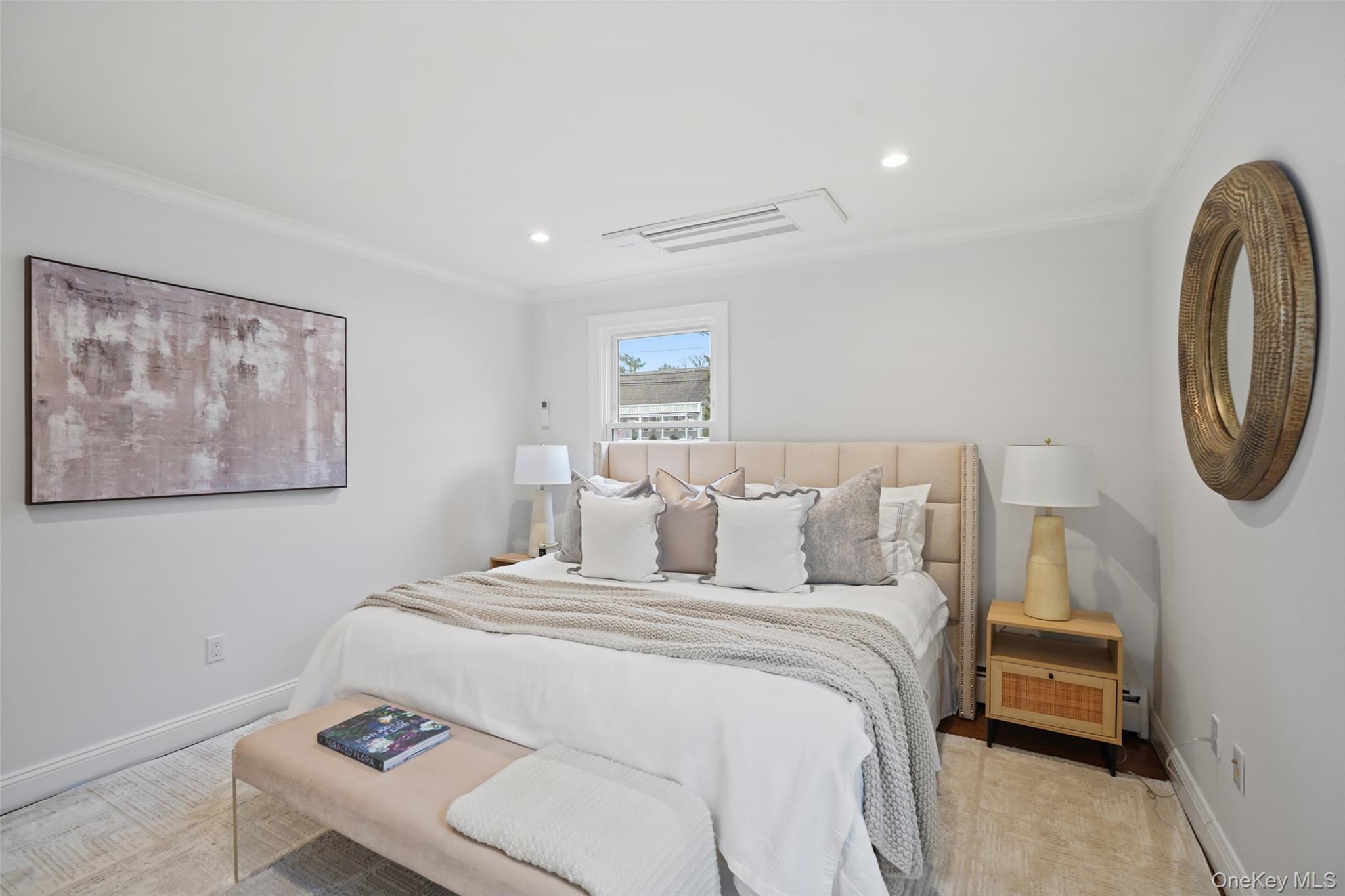 11 Orchard Avenue, Unit 3 Rye, NY 10580 - Photo 6 of 11 a bedroom with a bed and a painting on the wall