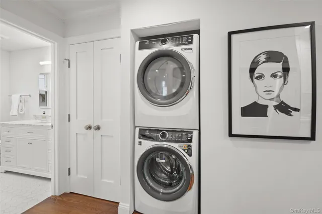 a view of a hallway with washer and dryer