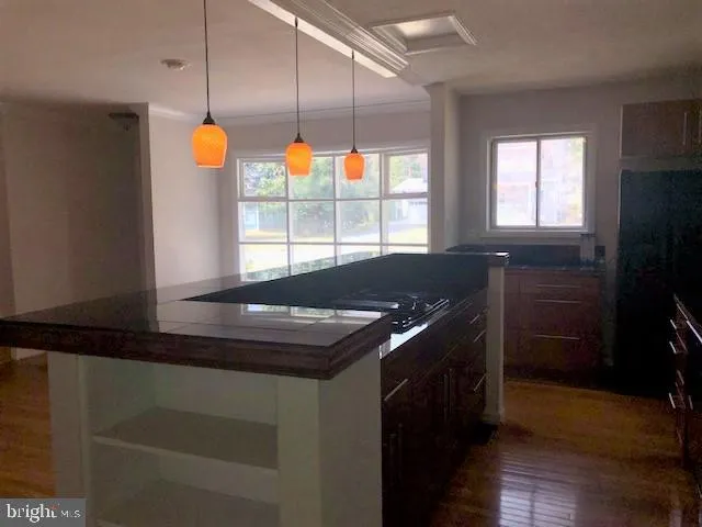 a kitchen with a sink and window