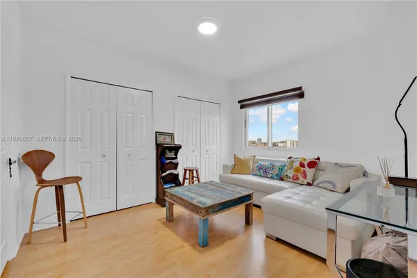 a living room with furniture and a window