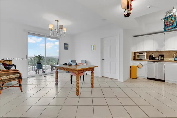 a view of kitchen with furniture and window