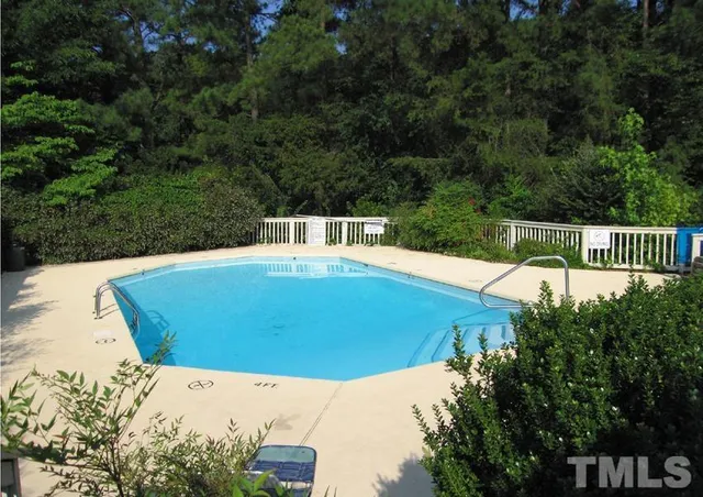 a view of a swimming pool with a patio