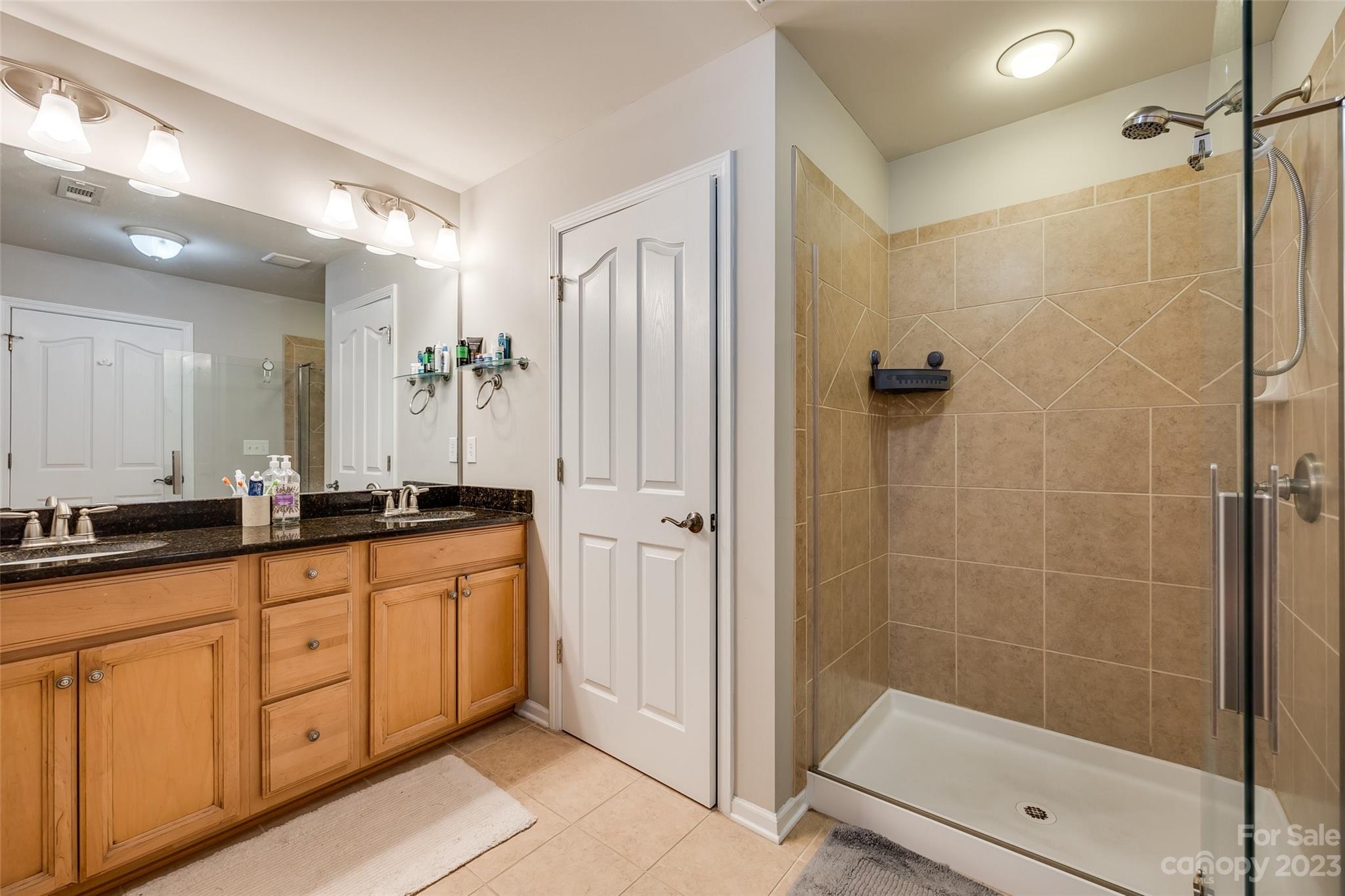 1055 Silver Gull Drive Tega Cay, SC 29708 - Photo 24 of 35 a bathroom with double sink and a shower