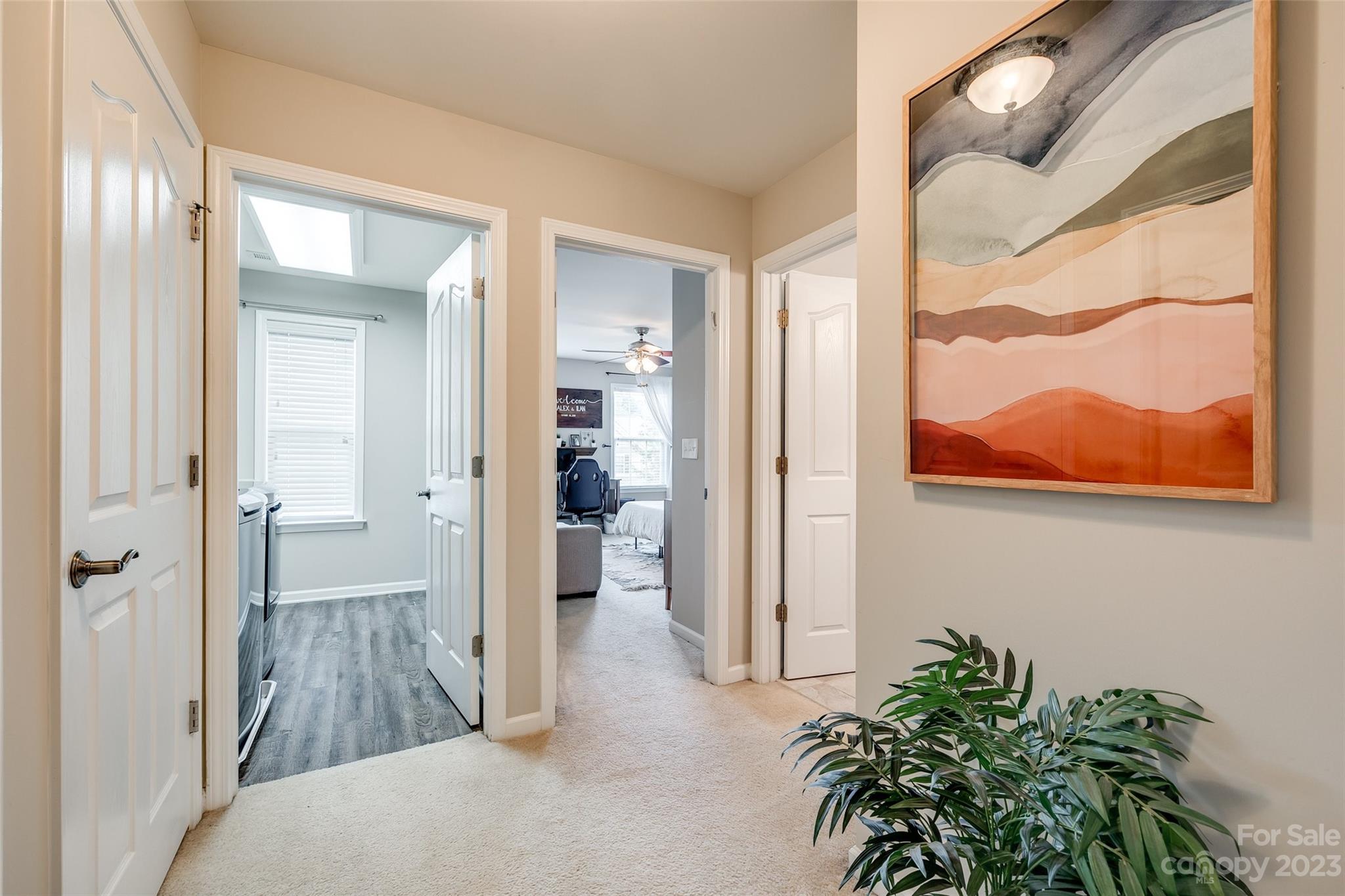 1055 Silver Gull Drive Tega Cay, SC 29708 - Photo 26 of 35 a view of hallway with bathroom and wooden floor