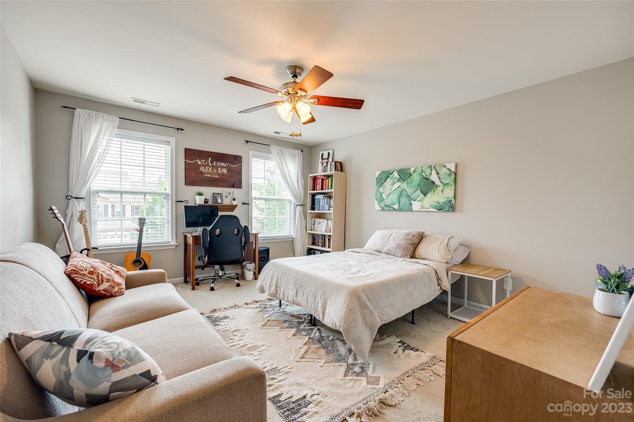 1055 Silver Gull Drive Tega Cay, SC 29708 - Photo 29 of 35 a bedroom with furniture and a large window