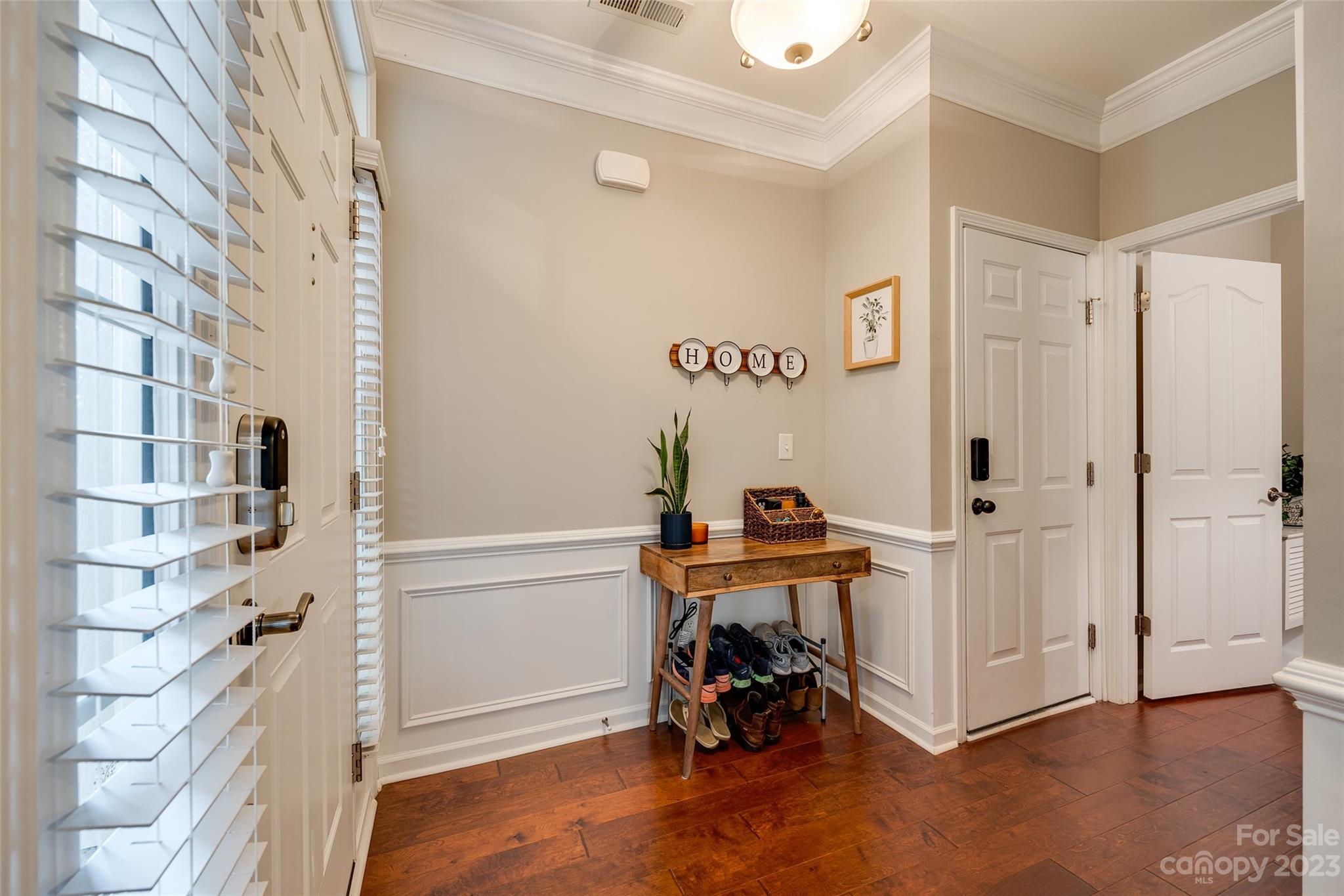 1055 Silver Gull Drive Tega Cay, SC 29708 - Photo 3 of 35 a view of a bedroom with a furniture and staircase