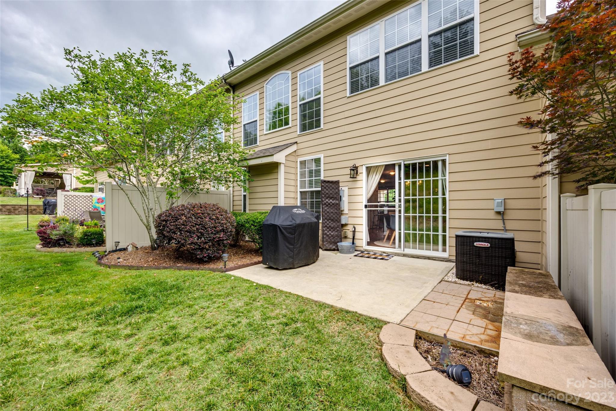 1055 Silver Gull Drive Tega Cay, SC 29708 - Photo 31 of 35 a view of a house with backyard sitting area and garden
