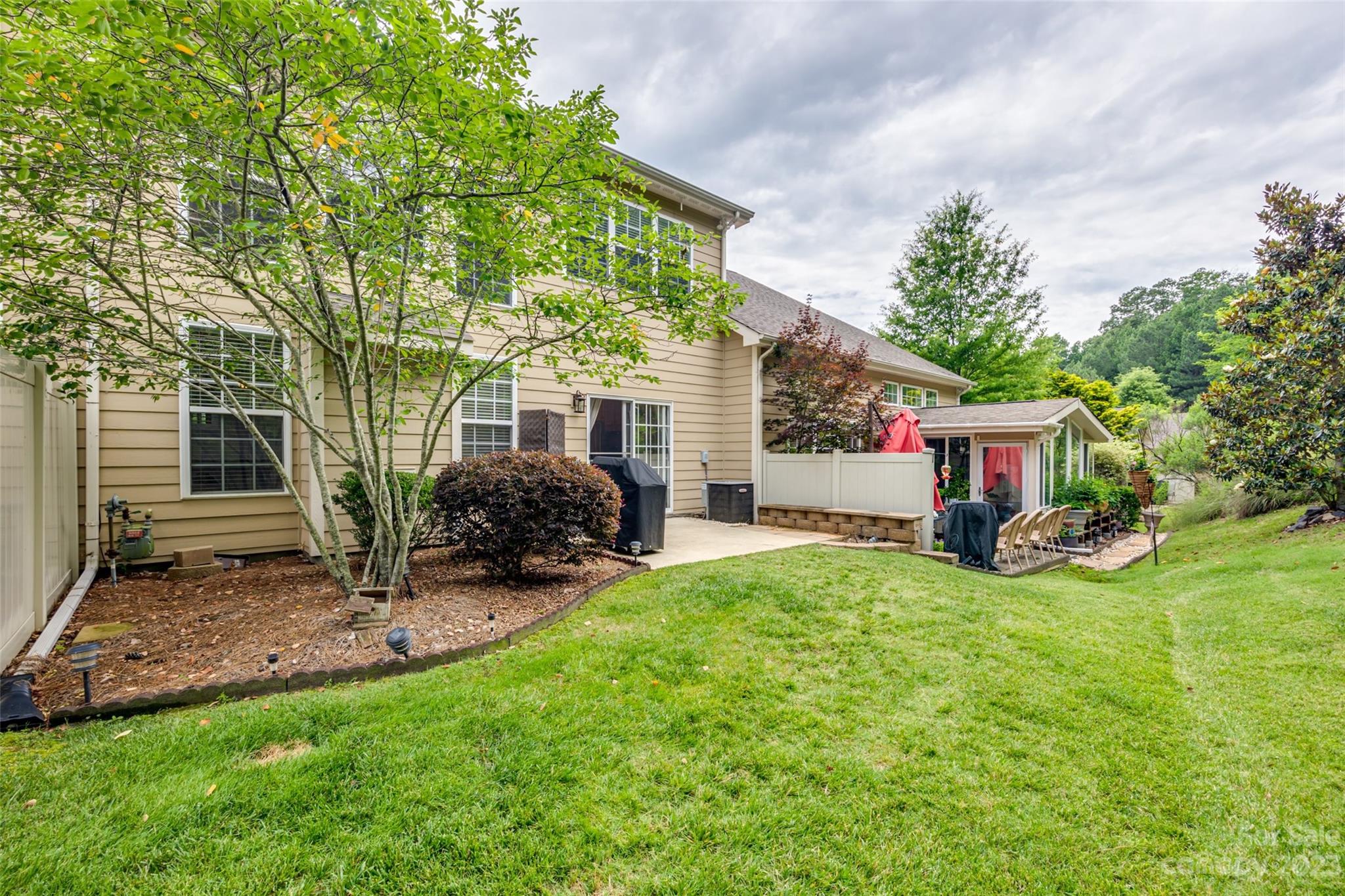 1055 Silver Gull Drive Tega Cay, SC 29708 - Photo 33 of 35 a view of a house with backyard and sitting area