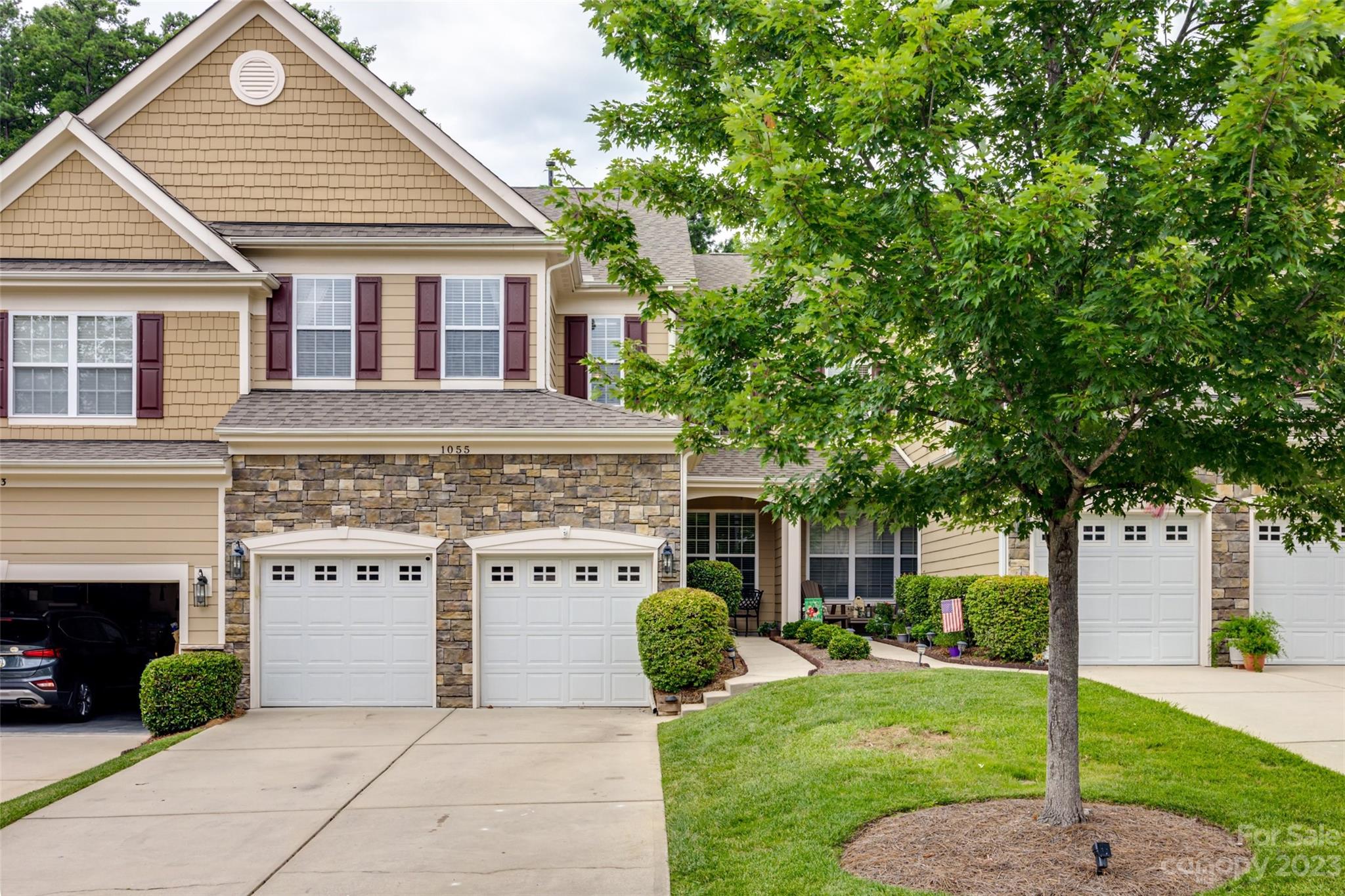 1055 Silver Gull Drive Tega Cay, SC 29708 - Photo 35 of 35 a view of a house with a yard and potted plants