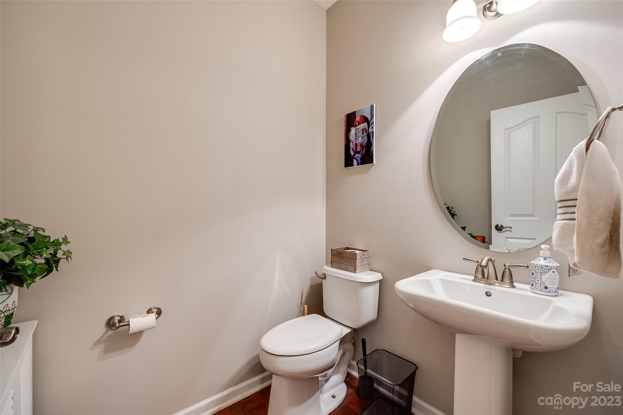 1055 Silver Gull Drive Tega Cay, SC 29708 - Photo 4 of 35 a bathroom with a sink toilet and a mirror