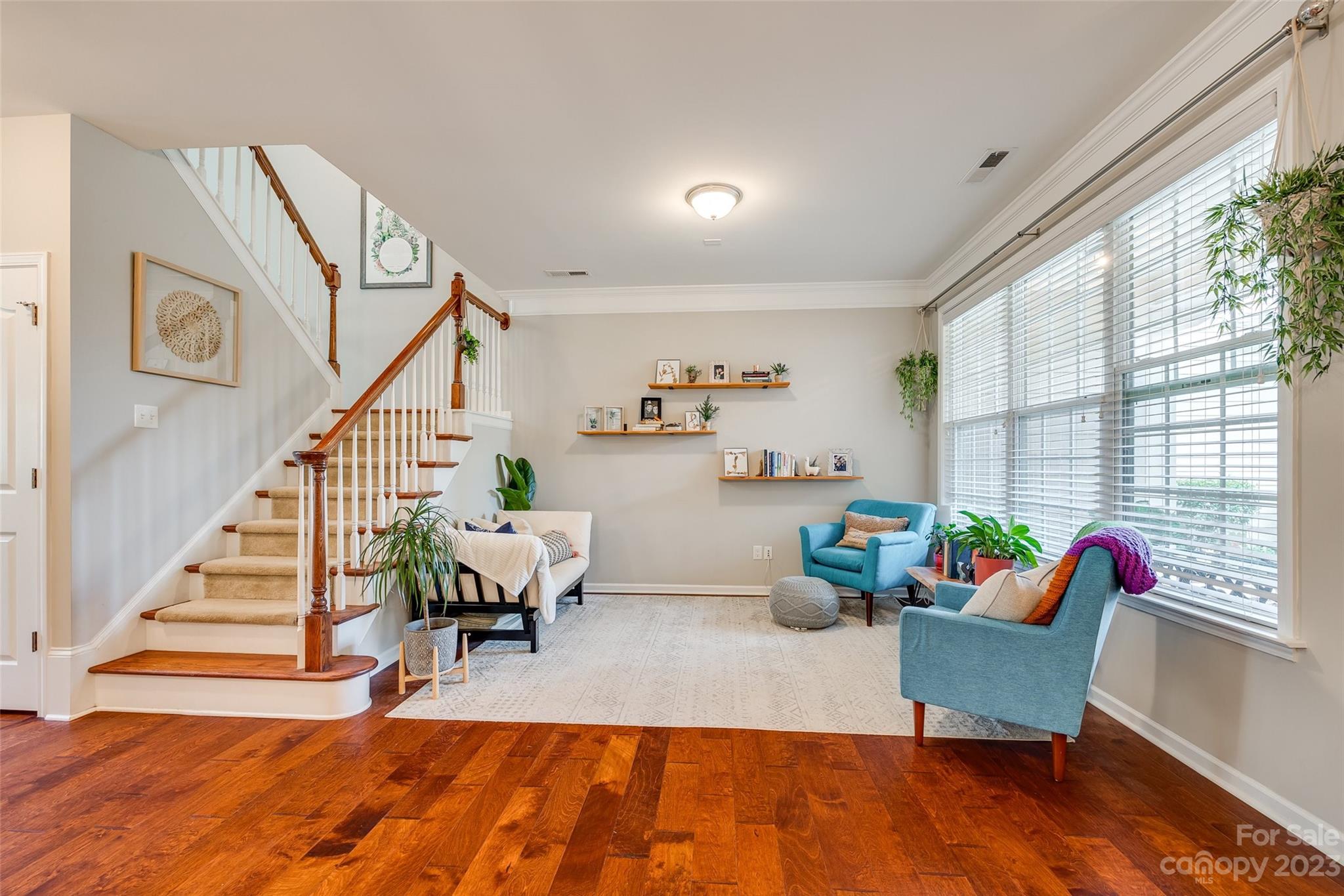 1055 Silver Gull Drive Tega Cay, SC 29708 - Photo 6 of 35 a living room with furniture and a wooden floor