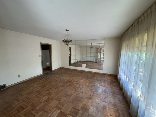 607 North Fleming Road Woodstock, IL 60098 - Photo 5 of 12 an empty room with a empty space and windows