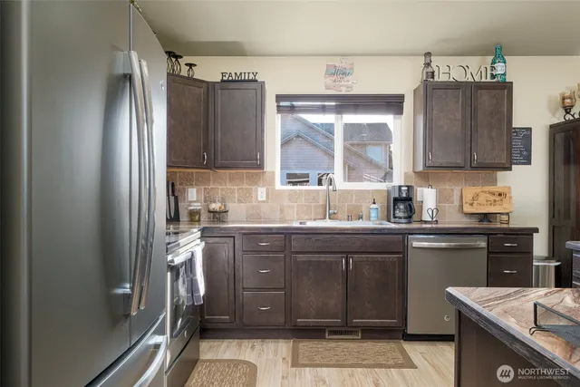 a spacious bedroom with a bed and a chandelier