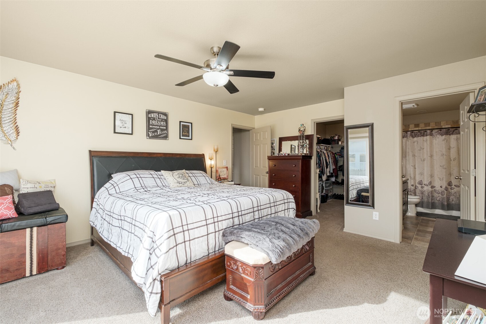 52 Linda Ridge Loop Ephrata, WA 98823 - Photo 16 of 40 a spacious bedroom with a bed and a chandelier