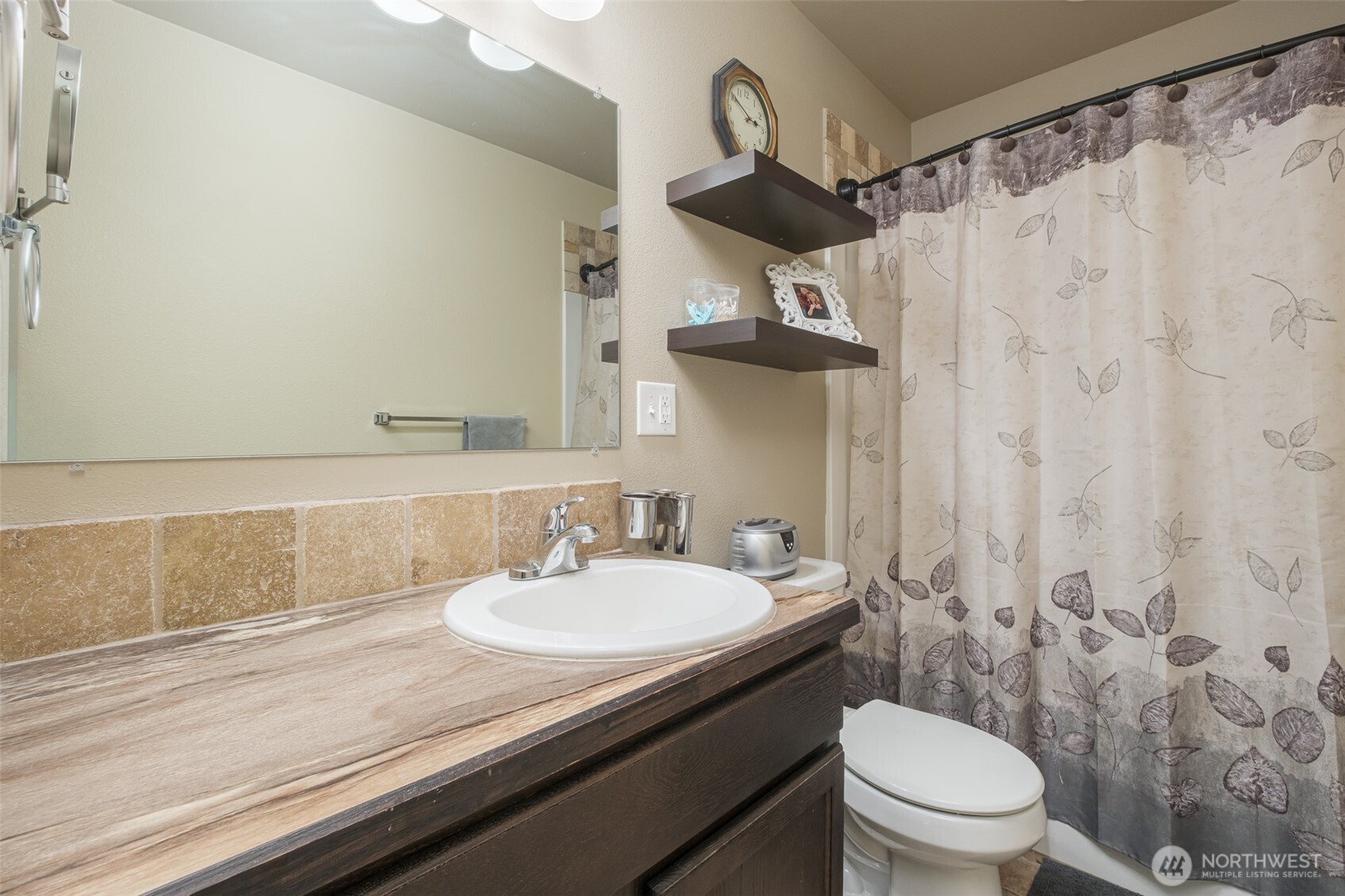 52 Linda Ridge Loop Ephrata, WA 98823 - Photo 17 of 40 a bathroom with a sink a toilet and shower curtain