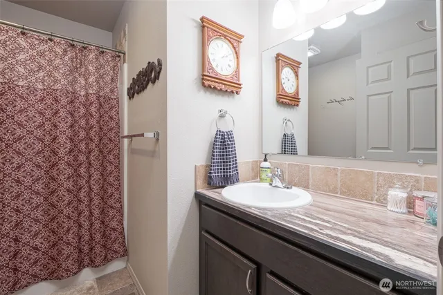 a view of a house with backyard and porch