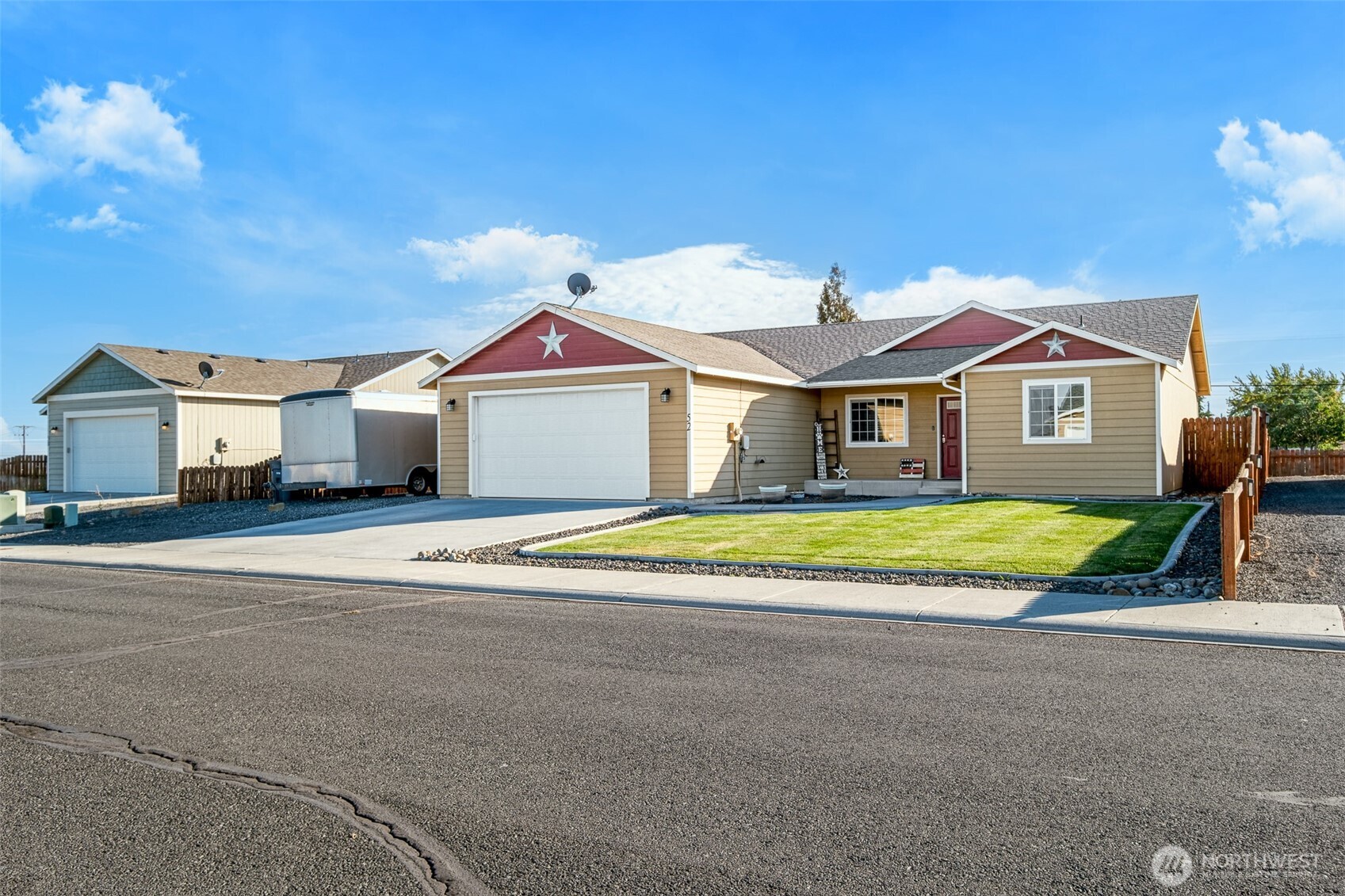 52 Linda Ridge Loop Ephrata, WA 98823 - Photo 24 of 40 a front view of a house with a yard and garage