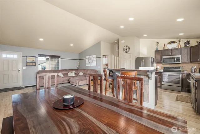 a kitchen with a sink appliances and cabinets