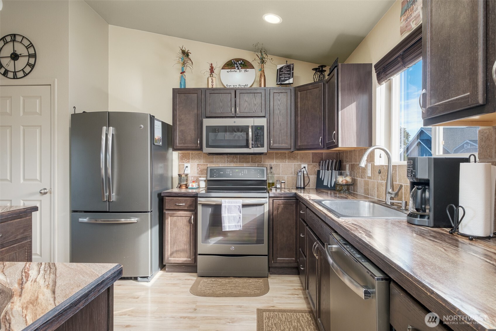 52 Linda Ridge Loop Ephrata, WA 98823 - Photo 8 of 40 a kitchen with granite countertop a refrigerator stove and sink