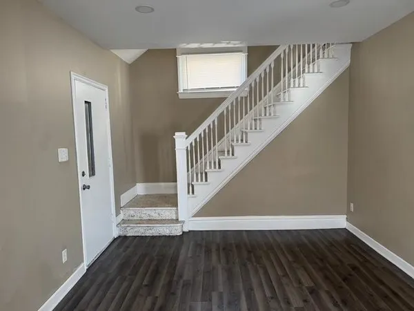 a view of entryway with wooden floor